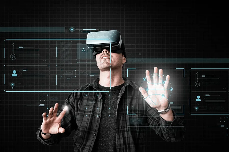 Homme portant un casque de réalité virtuelle et manipulant des interfaces holographiques en 3D